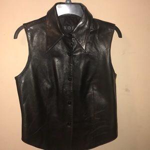 Black leather vest or sleeveless shirt